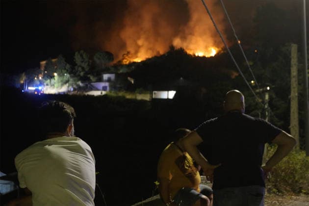 Wildfire threatens communities near Palermo in Sicily as firefighting efforts continue PALERMO, ITALY - JULY 23: Firefighters and civil protection teams battle a wildfire in the Casaboli Forest near Palermo as strong winds push the blaze toward the towns of Monreale, Pioppo and Sagana, while residents are evacuated from threatened homes, in Palermo, Sicily, Italy on July 23, 2026. The wildfire, which started the previous day, spread overnight, prompting emergency crews to work continuously to contain the flames and protect nearby communities. Alberto Lo Bianco Anadolu Palermo Italy. Editorial use only. Please get in touch for any other usage.  Copyright: x2026xAnadoluxAlbertoxLoxBiancox