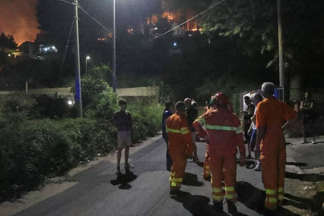 Wildfire threatens communities near Palermo in Sicily as firefighting efforts continue PALERMO, ITALY - JULY 23: Firefighters and civil protection teams battle a wildfire in the Casaboli Forest near Palermo as strong winds push the blaze toward the towns of Monreale, Pioppo and Sagana, while residents are evacuated from threatened homes, in Palermo, Sicily, Italy on July 23, 2026. The wildfire, which started the previous day, spread overnight, prompting emergency crews to work continuously to contain the flames and protect nearby communities. Alberto Lo Bianco Anadolu Palermo Italy. Editorial use only. Please get in touch for any other usage.  Copyright: x2026xAnadoluxAlbertoxLoxBiancox
