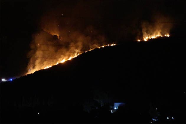 Wildfire threatens communities near Palermo in Sicily as firefighting efforts continue PALERMO, ITALY - JULY 23: Firefighters and civil protection teams battle a wildfire in the Casaboli Forest near Palermo as strong winds push the blaze toward the towns of Monreale, Pioppo and Sagana, while residents are evacuated from threatened homes, in Palermo, Sicily, Italy on July 23, 2026. The wildfire, which started the previous day, spread overnight, prompting emergency crews to work continuously to contain the flames and protect nearby communities. Alberto Lo Bianco Anadolu Palermo Italy. Editorial use only. Please get in touch for any other usage.  Copyright: x2026xAnadoluxAlbertoxLoxBiancox