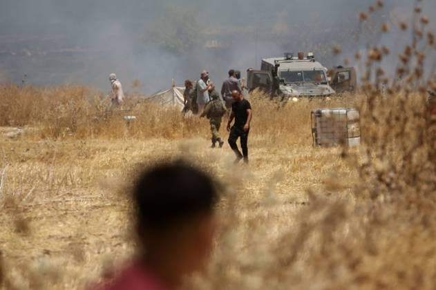 July 23, 2026, Beit Furik, Palestine, State of: BEIT FURIK, WEST BANK Ã¢â‚¬ JULY 23, 2026: Israeli settlers reportedly attack Palestinian farmers as they attempt to extinguish fires in wheat fields in the town of Beit Furik, east of Nablus, in the occupied West Bank. According to Palestinian residents, the fires were allegedly set by Israeli settlers before the confrontation. Beit Furik Palestine, State of - ZUMAq101 20260723_zna_q101_074 Copyright: xNedalxShtiehx