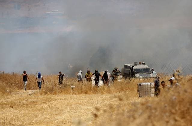 July 23, 2026, Beit Furik, Palestine, State of: BEIT FURIK, WEST BANK Ã¢â‚¬ JULY 23, 2026: Israeli settlers reportedly attack Palestinian farmers as they attempt to extinguish fires in wheat fields in the town of Beit Furik, east of Nablus, in the occupied West Bank. According to Palestinian residents, the fires were allegedly set by Israeli settlers before the confrontation. Beit Furik Palestine, State of  - ZUMAq101 20260723_zna_q101_079 Copyright: xNedalxShtiehx