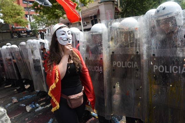 July 23, 2026, Tirana, Albania: The 54th day of protests known as the Flamingo Revolution. .Thousands of people have taken to the streets to demand the resignation of Prime Minister EDIÃ¢â‚¬â ¢ RAMAÃ¢â‚¬â ¢ s government and the cancellation of a luxury project in southern Albania linked to DOÃ¢â‚¬â ¢NALD TRUMPÃ¢â‚¬â ¢ s son-in-law.Protest participant wearing a Guy Fawkes mask facing security forces Tirana Albania  - ZUMAs232 20260723_zip_s232_001 Copyright: xErvinxShulkux