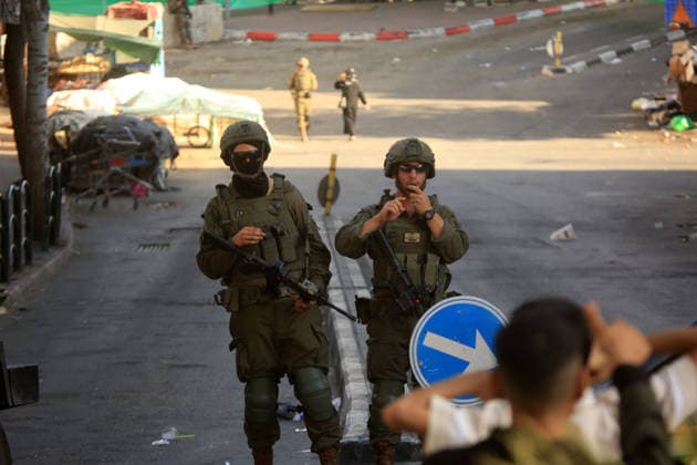 Israeli security forces deploy in Hebron city center Members of the Israeli security forces deploy in the Bab al-Zawiya area in the center of the West Bank city of Hebron on July 23, 2026, while closing streets and restricting the movement of Palestinians to secure the entry of Israeli settlers into the area, according to witnesses. Residents said the measures disrupted daily movement and forced a number of shops to close during the settlers visit. Photo by Mamoun Wazwaz apaimages Hebron West Bank Palestinian Territory 230726_Hebron_MW_00(10) Copyright: xapaimagesxMamounxWazwazx xapaimagesx