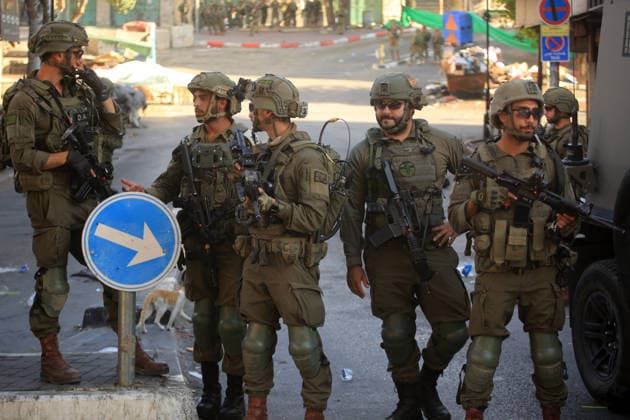 Israeli security forces deploy in Hebron city center Members of the Israeli security forces deploy in the Bab al-Zawiya area in the center of the West Bank city of Hebron on July 23, 2026, while closing streets and restricting the movement of Palestinians to secure the entry of Israeli settlers into the area, according to witnesses. Residents said the measures disrupted daily movement and forced a number of shops to close during the settlers visit. Photo by Mamoun Wazwaz apaimages Hebron West Bank Palestinian Territory 230726_Hebron_MW_00(20) Copyright: xapaimagesxMamounxWazwazx xapaimagesx