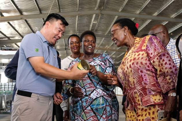 (260723) -- LUWERO, July 23, 2026 -- Ugandan Vice President Jessica Alupo (C) inspects a canned pineapple product during a tour of China-Uganda Agricultural Cooperation Industrial Park in Luwero District, Uganda, July 23, 2026. Ugandan Vice President Jessica Alupo on Thursday hailed the China-Uganda Agricultural Cooperation Industrial Park as a key driver of the country s agricultural transformation through agro-processing. TO GO WITH Uganda VP hails China-backed agro-industrial park for boosting agricultural transformation (Photo by Xinhua) UGANDA-LUWERO-VICE PRESIDENT-VISIT-CHINA-UGANDA-AGRO-INDUSTRIAL PARK HajarahxNalwadda 