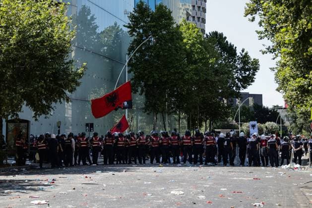 July 23, 2026, Tirana, Albania: TIRANA, ALBANIA Ã¢â‚¬ JULY 23, 2026: Demonstrators gathered outside the Albanian Parliament during the fifty-fourth consecutive day of anti-government protests in Tirana, Albania, on July 23, 2026. Protesters attempted to block lawmakers arriving for the parliamentary session, leading to confrontations with riot police. Officers deployed water cannons, pepper spray and physical force as clashes broke out outside the parliament building. Several demonstrators were detained, while both protesters and police officers sustained injuries during the unrest. The protest movement, which began in opposition to a proposed luxury tourism development project linked to Jared Kushner and other international investors, h - ZUMAq101 20260723_zna_q101_155 Copyright: xVlasovxSulajx