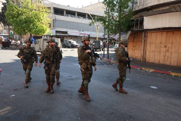July 23, 2026, Hebron, Palestine, State of: HEBRON, WEST BANK Ã¢â‚¬ JULY 23, 2026: Israeli forces closed the central market and restricted the movement of Palestinians in the city of Hebron during a raid on the area to secure settlers access to the Tomb of the Patriarchs, where they performed Jewish prayers, on July 23, 2026. Hebron Palestine, State of - ZUMAq101 20260723_zna_q101_175 Copyright: xMosabxShawerx
