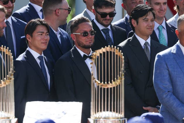 DC: Trump Hosts 2025 MLB World Series Champions LA Dodgers at White House Yoshinobu Yamamoto, Miguel Rojas and Shohei Ohtani listen to President Donald Trump during an event with the 2025 MLB World Series Champions the Los Angeles Dodgers in the Rose Garden at the White House on July 23, 2026 in Washington, D.C. The Dodgers defeated the Toronto Blue Jays in Game 7 of the 2025 MLB World Series to claim back-to-back championship titles. (Photo by Samuel Corum Pool ABACAPRESS.COM) Washington DC United States  Copyright: xPool ABACAx