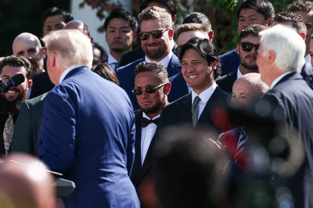 DC: Trump Hosts 2025 MLB World Series Champions LA Dodgers at White House Miguel Rojas and Shohei Ohtani listen to President Donald Trump during an event with the 2025 MLB World Series Champions the Los Angeles Dodgers in the Rose Garden at the White House on July 23, 2026 in Washington, D.C. The Dodgers defeated the Toronto Blue Jays in Game 7 of the 2025 MLB World Series to claim back-to-back championship titles. (Photo by Samuel Corum Pool ABACAPRESS.COM) Washington DC United States  Copyright: xPool ABACAx