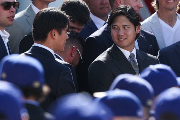 DC: Trump Hosts 2025 MLB World Series Champions LA Dodgers at White House Yoshinobu Yamamoto and Shohei Ohtani attend an event with the 2025 MLB World Series Champions the Los Angeles Dodgers in the Rose Garden at the White House on July 23, 2026 in Washington, D.C. The Dodgers defeated the Toronto Blue Jays in Game 7 of the 2025 MLB World Series to claim back-to-back championship titles. (Photo by Samuel Corum Pool ABACAPRESS.COM) Washington DC United States  Copyright: xPool ABACAx