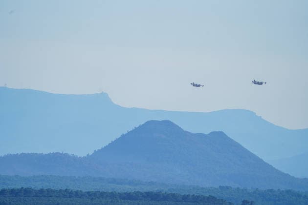 Wildfire reignites with strong Mistral wind in France. France - Cotignac, 23.07.2026 Silhouette of two Canadair CL-415 as a wildfire spreads again near Cotignac in the Var department, southeastern France on Thursday. Strong Mistral winds fueled renewed fire activity, prompting a large firefighting operation. Departement Var