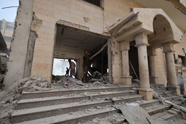 Palestinians inspect building damaged in Israeli airstrike in Gaza City Palestinians inspect the damage to a building following an Israeli airstrike on al-Jalaa Street in central Gaza City, Gaza Strip, on July 24, 2026. Photo by Hadi Daoud apaimages Gaza city Gaza Strip Palestinian Territory 240726_Gaza_HD_00(12) Copyright: xapaimagesxHadixDaoudx xapaimagesx