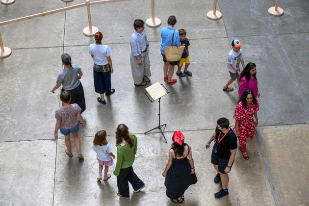 July 24, 2026, London, London, UK: Visitors interact with artist Lina LapelytÄ Ã¢â‚¬â ¢created maze-like installation, transforming the Turbine Hall into a collaborative stage. Audiences are invited to co-create in a piece of mass choreography, moving through a grid of wooden barriers. You are also free to quietly watch the performance unfold, from the Turbine Hall bridge. London, UK. London UK  - ZUMAl94_ 20260724_zaf_l94_011 Copyright: xRayxTangx