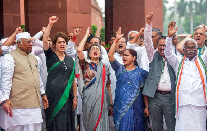 Opposition MPs take part in protest demanding the resignation of Union Education Minister Dharmendra Pradhan during the Parliament s Monsoon Session New Delhi, Jul 24 (ANI): Rajya Sabha LoP and Congress President Mallikarjun Kharge, Congress MP Priyanka Gandhi and TMC MP Sagarika Ghose with other Opposition MPs take part in protest demanding the resignation of Union Education Minister Dharmendra Pradhan at the Parliament premises during the ongoing Monsoon Session, in New Delhi on Friday. New Delhi Delhi India Copyright: xANIx ANI_20260724126
