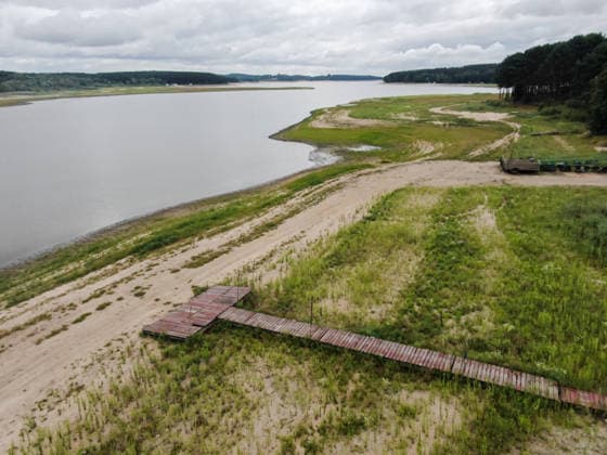 Poland s drought intensifies as climate change dries reservoirs RAKOW, POLAND - JULY 24: An aerial view of the Chancza Reservoir with low water levels due to the ongoing drought in Rakow, Poland, on July 24, 2026. Low water levels have been recorded at 66 percent of Poland s hydrological monitoring stations. Earlier in July, Poland s national weather agency warned that hydrological drought had spread across much of the country. Officials reported falling river levels, declining groundwater supplies, and an increasing number of monitoring stations recording flows below long-term minimum thresholds. Omar Marques Anadolu Rakow Poland. Editorial use only. Please get in touch for any other usage.  Copyright: x2026xAnadoluxOmarxMarquesx