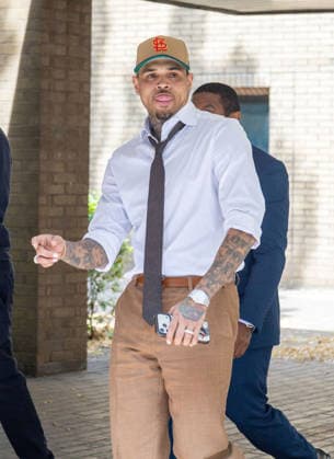 July 24, 2026, London, England, United Kingdom: R&B singer CHRIS BROWN leaves Southwark Crown Court after a case management hearing. He is charged over an alleged assault in a London nightclub. The American musician is accused of causing grievous bodily harm to Abraham Diaw in February 2023. London United Kingdom - ZUMAs262 20260724_zip_s262_003 Copyright: xTayfunxSalcix