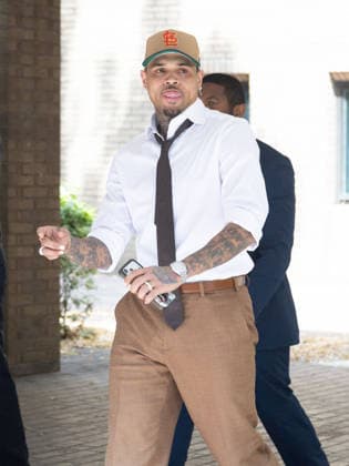 July 24, 2026, London, England, United Kingdom: R&B singer CHRIS BROWN leaves Southwark Crown Court after a case management hearing. He is charged over an alleged assault in a London nightclub. The American musician is accused of causing grievous bodily harm to Abraham Diaw in February 2023. London United Kingdom  - ZUMAs262 20260724_zip_s262_008 Copyright: xTayfunxSalcix