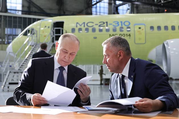 RUSSIA, IRKUTSK - JULY 24, 2026: Vladimir Putin (L), President of Russia, and Igor Kobzev, Irkutsk Region Governor, visit the Irkutsk Aviation Plant owned by Rostec s United Aircraft Corporation. Yevgeny Messman TASS  95394328