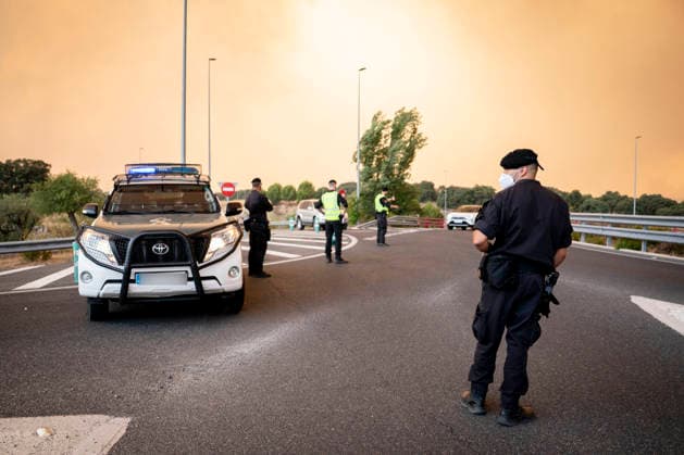 The wildfires in the Community of Madrid have merged into a single front, and a third front is being monitored from Ávila. Road blocked, July 2, 2026, in Chapinería, Madrid, Spain. The wildfires affecting the Community of Madrid continue to spread unchecked and have merged into a single fire, while in Ávila, the Burgohondo fire is also advancing unchecked, forcing the central government to declare a national emergency on a day when weather forecasts of strong gusts of wind are hampering firefighting efforts. So far, 9,000 hectares have been burned in Ávila and another 6,000 in Madrid. JULY 24, 2026 FOREST FIRE (PIXELATED) A Pé Madrid Madrid, Spain  Copyright: xA.xPÃ rezxMecax 7685232