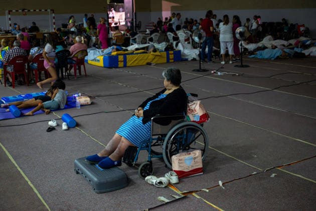 July 24, 2026, Madrid, Madrid, Spain: Nearly 1,000 people evacuated due to a wave of wildfires in the southwest of the Madrid region spend the night sheltered at the Villamanta municipal sports center, hastily converted into an emergency reception facility. Madrid Spain - ZUMAd308 20260724_zsp_d308_002 Copyright: xJuanxCarlosxLucasx