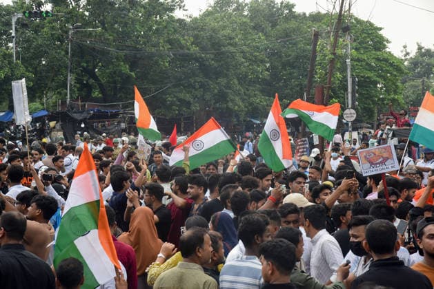 Kolkata Students Protest Pradhan Students and activists wave Indian flags while marching through a crowded street in Kolkata, India, on July 24, 2026. The rally, titled All Cockroaches of Bengal, marched from Sealdah to Dharmatala to protest against Union Education Minister Dharmendra Pradhan and alleged police violence in Delhi, with students from several organizations taking part. Kolkata West Bengal India Copyright: xAmitxGhoshx