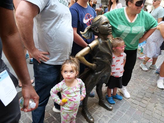 July 24, 2026, New York, New York, USA: Fearless Girl Block Party outside the NYSE. The Ten Year anniversary of the.girl empowering sculpture by Kristen Visbal was celebrated with music, free giveaways, and.live vendors. The event pays homage to the millions who line up to be photographed with her..State Street an exchange traded fund commissioned the art work in 2017 which originally stood opposite the .Wall Street Charging Bull but was moved to opposite the Stock Excahnge encouraging girls theu can do anything. New York USA - ZUMAh156 20260724_znp_h156_002 Copyright: xMiloxHessx