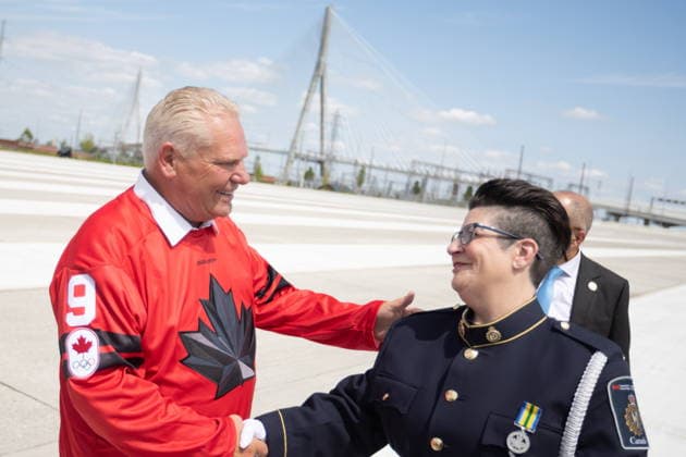 July 24, 2026, Windsor, On, CANADA: Ontario Premier Doug Ford, left, shakes hands with Canada Border Services agent Lisa Citron at a ribbon cutting ceremony for the opening of the Gordie Howe International Bridge, in Windsor, Ont., Friday, July 24, 2026. Windsor CANADA  - ZUMAc35_ 20260724_zaf_c35_081 Copyright: xDaxxMelmerx