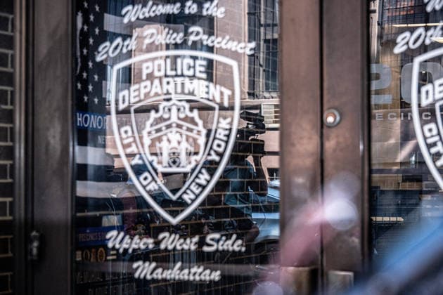 July 24, 2026, New York, New York, USA: A cameraman can be seen in reflection outside the 20th Precinct as the media waits for Raul Morales, 51 to walk out from the 20th Precinct on the Upper Westside in Manhattan, after being charged with attempted murder as a hate crime, assault as a hate crime and criminal possession of a weapoon for the attack on Moshe Grunhaus, a 50 year old Jewish man. For the attack on an Asian man, he is also charged but not as a hate crime, on July 24, 2026. New York USA - ZUMAb230 20260724_znp_b230_008 Copyright: xLauraxBrettx