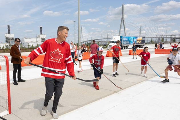 July 24, 2026, Windsor, On, CANADA: Minister of Housing and Infrastructure Gregor Robertson, left, plays ball hockey at a ribbon cutting ceremony for the opening of the Gordie Howe International Bridge, in Windsor, Ont., Friday, July 24, 2026. Windsor CANADA  - ZUMAc35_ 20260724_zaf_c35_097 Copyright: xDaxxMelmerx
