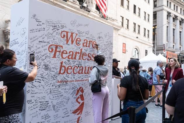 July 24, 2026, New York, New York, USA: State Street (index STT) rings closing bell to celebrate Fearless Girl of the New York Stock Exchange (NYSE) in New York, NY on July 24, 2026. The Fearless Girl is a famous four-foot bronze statue created by artist Kristen Visbal and commissioned by State Street Global Advisors (a division of State Street Corporation). To mark the occasion State Street throw the block party in front of NYSE. New York USA  - ZUMAr339 20260724_znp_r339_004 Copyright: xLevxRadinx