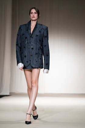 ROMANIAN DESIGNERS - MOMAD Fashion Week de Madrid ,Spain - 24 Jul 2026 A model walks the runway wearing a design by Romanian designers during Momad Fashion Week de Madrid in IFEMA Madrid Spain Copyright: xAtilanoxGarciax xSOPAxImagesx photo03114
