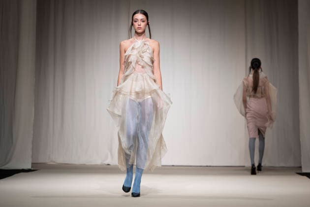 ROMANIAN DESIGNERS - MOMAD Fashion Week de Madrid ,Spain - 24 Jul 2026 A model walks the runway wearing a design by Romanian designers during Momad Fashion Week de Madrid in IFEMA Madrid Spain Copyright: xAtilanoxGarciax xSOPAxImagesx photo03129