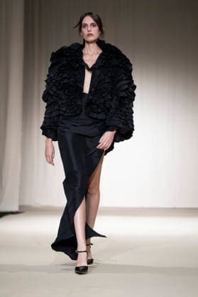 ROMANIAN DESIGNERS - MOMAD Fashion Week de Madrid ,Spain - 24 Jul 2026 A model walks the runway wearing a design by Romanian designers during Momad Fashion Week de Madrid in IFEMA Madrid Spain Copyright: xAtilanoxGarciax xSOPAxImagesx photo03147