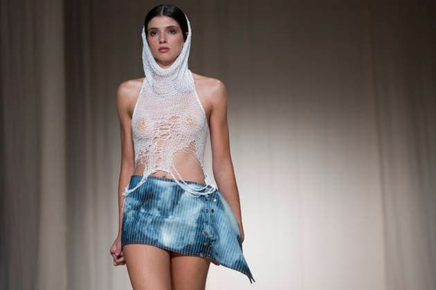 ROMANIAN DESIGNERS - MOMAD Fashion Week de Madrid ,Spain - 24 Jul 2026 A model walks the runway wearing a design by Romanian designers during Momad Fashion Week de Madrid in IFEMA Madrid Spain Copyright: xAtilanoxGarciax xSOPAxImagesx photo03151