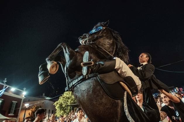 July 24, 2026, Es Castell, Menorca Balearic Islands, Spain: A caixer, or horse rider, rears his horse amid a cheering crowd during the traditional Jaleo at the Sant MartoÂ­ Festival in Es Castell. Es Castell Spain  - ZUMAo105 20260724_fap_o105_003 Copyright: xMatthiasxOesterlex