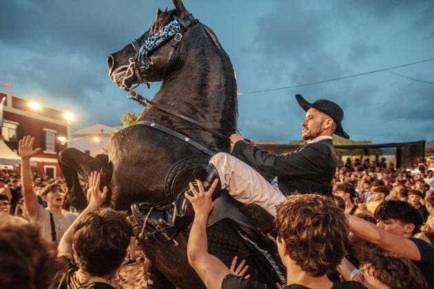 July 24, 2026, Es Castell, Menorca Balearic Islands, Spain: A caixer, or horse rider, rears his horse amid a cheering crowd during the traditional Jaleo at the Sant MartoÂ­ Festival in Es Castell. Es Castell Spain  - ZUMAo105 20260724_fap_o105_006 Copyright: xMatthiasxOesterlex