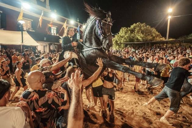 July 24, 2026, Es Castell, Menorca Balearic Islands, Spain: A caixer, or horse rider, rears his horse amid a cheering crowd during the traditional Jaleo at the Sant MartoÂ­ Festival in Es Castell. Es Castell Spain  - ZUMAo105 20260724_fap_o105_013 Copyright: xMatthiasxOesterlex