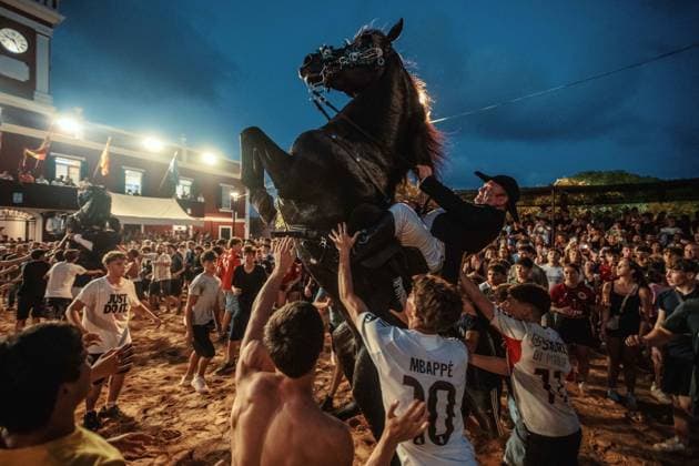 July 24, 2026, Es Castell, Menorca Balearic Islands, Spain: A caixer, or horse rider, rears his horse amid a cheering crowd during the traditional Jaleo at the Sant MartoÂ­ Festival in Es Castell. Es Castell Spain  - ZUMAo105 20260724_fap_o105_021 Copyright: xMatthiasxOesterlex