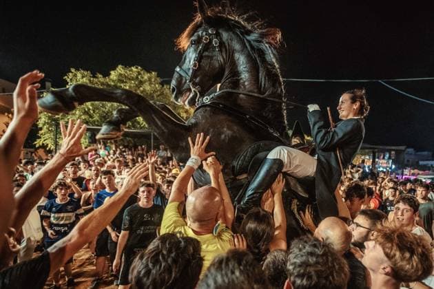 July 24, 2026, Es Castell, Menorca Balearic Islands, Spain: A caixer, or horse rider, rears his horse amid a cheering crowd during the traditional Jaleo at the Sant MartoÂ­ Festival in Es Castell. Es Castell Spain  - ZUMAo105 20260724_fap_o105_022 Copyright: xMatthiasxOesterlex