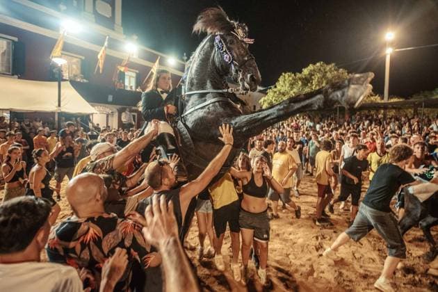 July 24, 2026, Es Castell, Menorca Balearic Islands, Spain: A caixer, or horse rider, rears his horse amid a cheering crowd during the traditional Jaleo at the Sant MartoÂ­ Festival in Es Castell. Es Castell Spain  - ZUMAo105 20260724_fap_o105_026 Copyright: xMatthiasxOesterlex