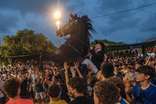 July 24, 2026, Es Castell, Menorca Balearic Islands, Spain: A caixer, or horse rider, rears his horse amid a cheering crowd during the traditional Jaleo at the Sant MartoÂ­ Festival in Es Castell. Es Castell Spain - ZUMAo105 20260724_fap_o105_011 Copyright: xMatthiasxOesterlex