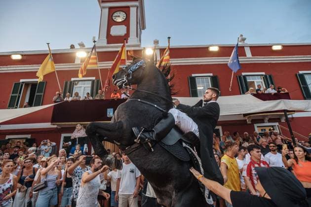 July 24, 2026, Es Castell, Menorca Balearic Islands, Spain: A caixer, or horse rider, rears his horse amid a cheering crowd during the traditional Jaleo at the Sant MartoÂ­ Festival in Es Castell. Es Castell Spain - ZUMAo105 20260724_fap_o105_012 Copyright: xMatthiasxOesterlex