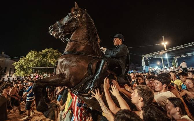 July 24, 2026, Es Castell, Menorca Balearic Islands, Spain: A caixer, or horse rider, rears his horse amid a cheering crowd during the traditional Jaleo at the Sant MartoÂ­ Festival in Es Castell. Es Castell Spain  - ZUMAo105 20260724_fap_o105_030 Copyright: xMatthiasxOesterlex