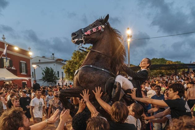 July 24, 2026, Es Castell, Menorca Balearic Islands, Spain: A caixer, or horse rider, rears his horse amid a cheering crowd during the traditional Jaleo at the Sant MartoÂ­ Festival in Es Castell. Es Castell Spain - ZUMAo105 20260724_fap_o105_019 Copyright: xMatthiasxOesterlex