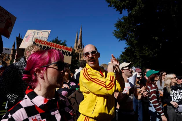 SING-IN PROTEST, People sing and dance during a Sing-In™ protest in solidarity with Divine Playhouse at Hyde Park in Sydney, Saturday, July 25, 2026. The Trans Theatre Group was evicted from its rental property in Kent Street after its landlord Revelop terminated the venue s lease claiming offensive trade - a legal term deriving from an 1842 NSW law implemented to regulate foul smells and industrial waste - and never once in 184 years has a court been asked to consider if it extends to moral offensiveness. ( NO ARCHIVING SYDNEY NEW SOUTH WALES AUSTRALIA  Copyright: xJESSICAxHROMASx 20260725195188290772