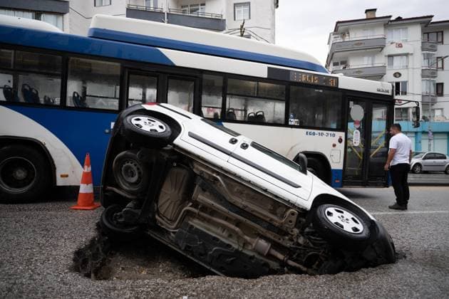 Heavy rainfall causes flooding, road collapse in Ankara ANKARA, TURKIYE – JULY 25: A car is seen trapped in a sinkhole after the road collapsed following heavy rainfall in Ankara, Turkiye, on July 25, 2026. Intense morning downpours caused sections of the road to give way, leaving the vehicle partially submerged. Muhammed Abdullah Kurtar Anadolu Ankara Turkey. Editorial use only. Please get in touch for any other usage.  Copyright: x2026xAnadoluxMuhammedxAbdullahxKurtarx