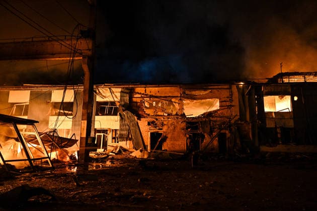 A shopping complex burns following a Russian attack in Zaporizhzhia, Ukraine, July 25, 2026. In the early hours of Saturday, July 25, Russian troops struck the southeastern Ukrainian city with drones, igniting a fire that spread through shops and trading pavilions over an area of about 900 square metres. A 63-year-old man was injured in the drone strike. (Photo by Dmytro Smolienko Ukrinform) Russian army attacks Zaporizhzhia with drones  Copyright: xDmytroxSmolienkox