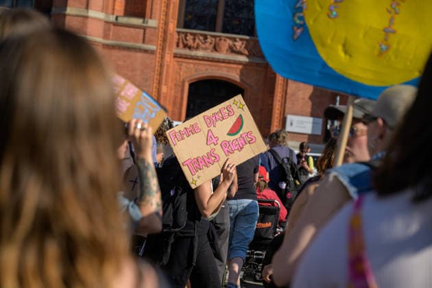 July 24, 2026, Berlin, Berlin, Germany: A person holds a placard showing the support withthe Palestinians at Dyke* March 2026, on July 24 2026, in Berlin, Germany. Thousands of demonstrators marched in the streets of Berlin s City Center and Kreuzberg districts for the annual Dyke* March just a day before the annual CSD parade and Internationalist Queer Pride Berlin Germany - ZUMAk201 20260724_zip_k201_001 Copyright: xNikosxKanistrasx
