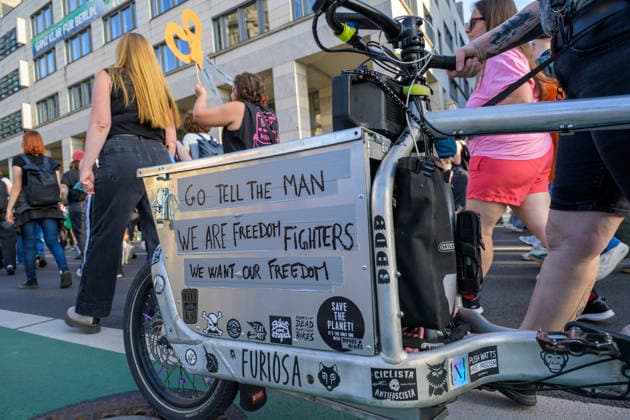 July 24, 2026, Berlin, Berlin, Germany: A person writes anti-patriarchical slogan slogans on their vehicle at Dyke* March 2026, on July 24 2026, in Berlin, Germany. Thousands of demonstrators marched in the streets of Berlin s City Center and Kreuzberg districts for the annual Dyke* March just a day before the annual CSD parade and Internationalist Queer Pride Berlin Germany - ZUMAk201 20260724_zip_k201_005 Copyright: xNikosxKanistrasx