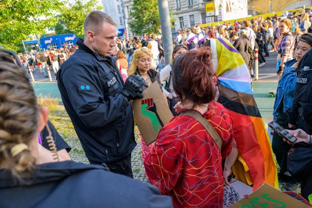July 24, 2026, Berlin, Berlin, Germany: A police officer arrest one of the demonstrators because they hold a placard of a fist painted in the Palestine s flag colors at Dyke* March 2026, on July 24 2026, in Berlin, Germany. Thousands of demonstrators marched in the streets of Berlin s City Center and Kreuzberg districts for the annual Dyke* March just a day before the annual CSD parade and Internationalist Queer Pride Berlin Germany - ZUMAk201 20260724_zip_k201_011 Copyright: xNikosxKanistrasx